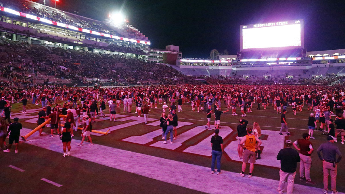 Sep 6, 2025; Starkville, Mississippi, USA; Mississippi State Bulldogs fans storm the field after defeating the Arizona State Sun Devils at Davis Wade Stadium at Scott Field. Mandatory Credit: Petre Thomas-Imagn Images