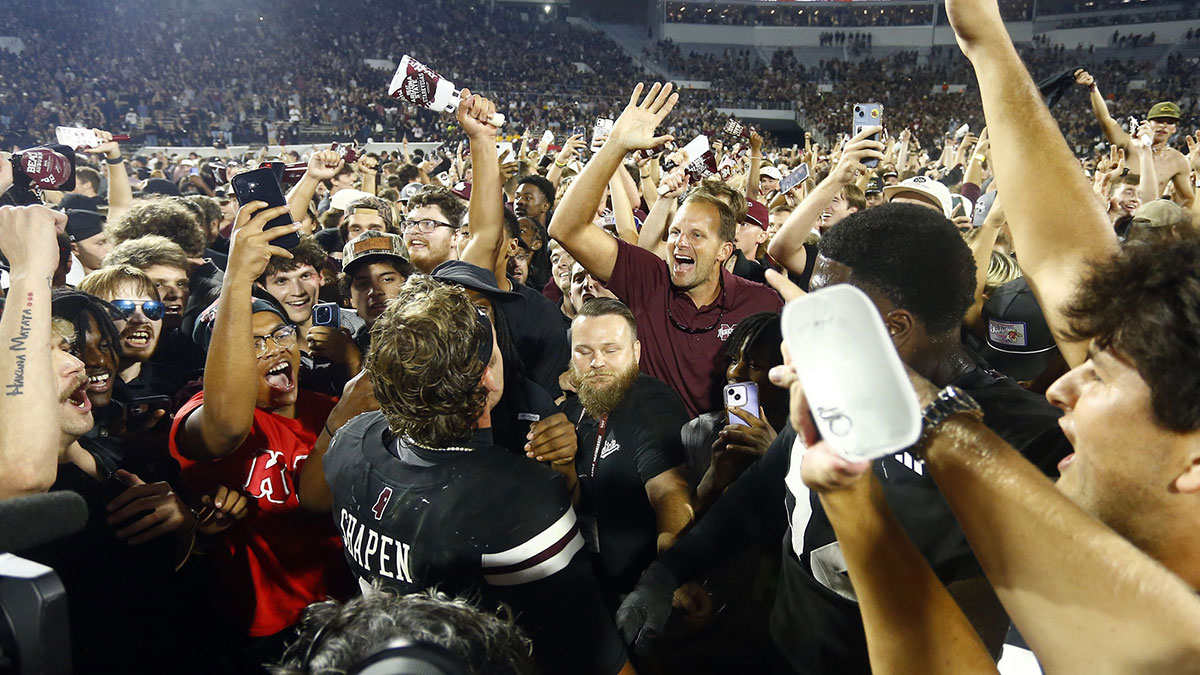 Mississippi State Bulldogs fans crowd around quarterback Blake Shapen (2) after defeating the Arizona State Sun Devilsat Davis Wade Stadium at Scott Field.