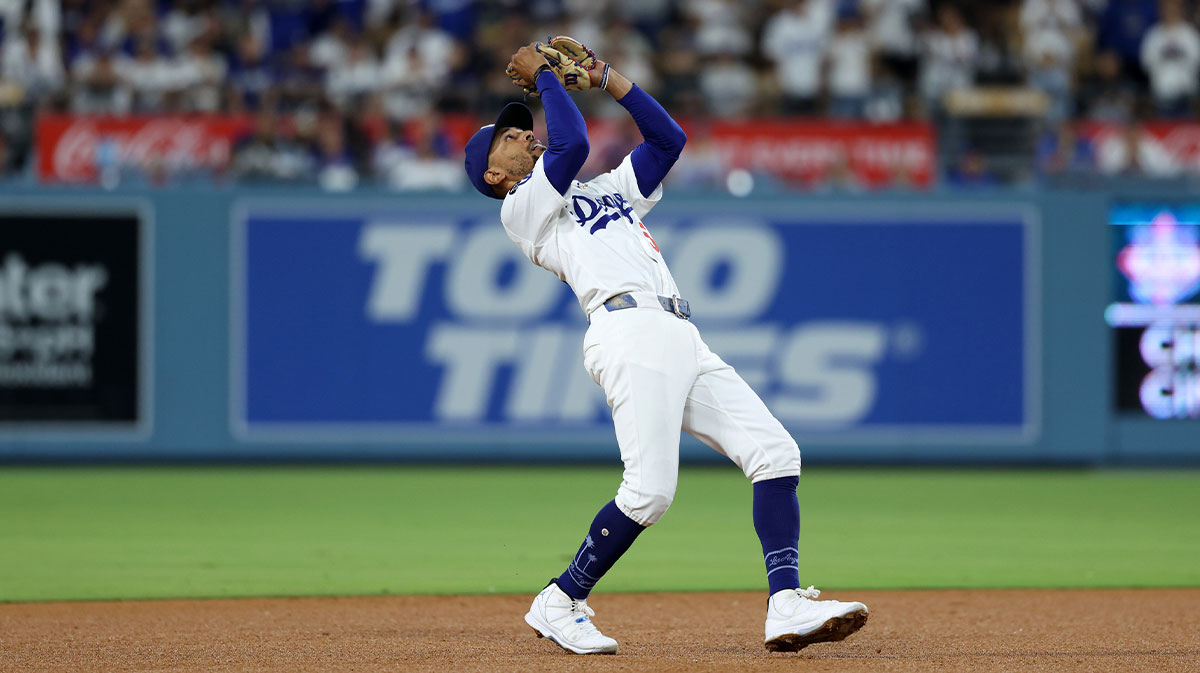Los Angeles Dodgers shortstop Mookie Betts (50) catches a fly ball for the last out of the game during the ninth inning against the San Francisco Giants at Dodger Stadium.