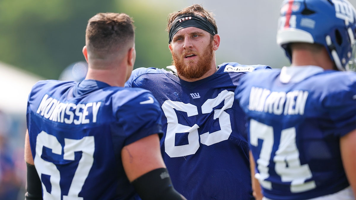 New York Giants guard Jake Kubas (63) talks with center Jimmy Morrissey (67) during training camp at Quest Diagnostics Training Center.
