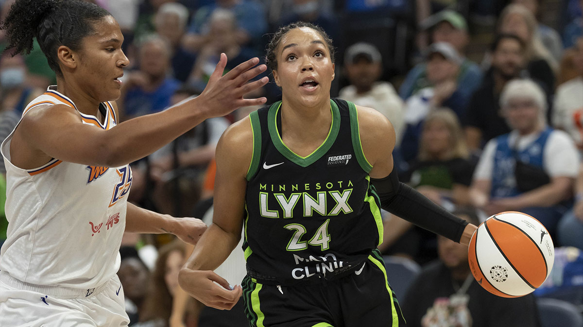 Minnesota Lynx forward Napheesa Collier (24) dribbles the ball past Phoenix Mercury forward Alyssa Thomas (25) in the first half during game one of the second round for the 2025 WNBA Playoffs at Target Center.