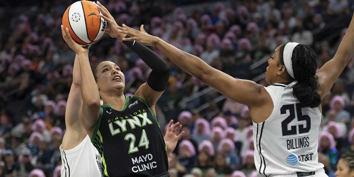 Minnesota Lynx forward Napheesa Collier (24) shoots over Golden State Valkyries forward Monique Billings (25) in the second half at Target Center.