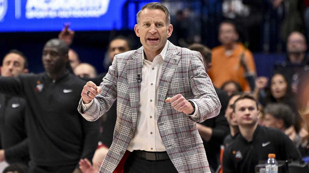Alabama Crimson Tide head coach Nate Oats cheers after a made basket against the Florida Gators during the first half at Bridgestone Arena.