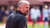 Nebraska Cornhuskers head coach Matt Rhule walks onto the field before the game against the Michigan Wolverines at Memorial Stadium.