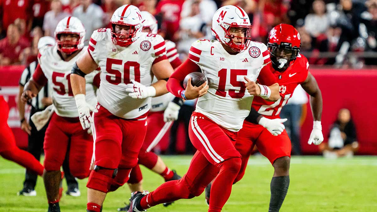 Nebraska Cornhuskers quarterback Dylan Raiola (15) runs against Cincinnati Bearcats wide receiver Taizaun Burns (27) during the third quarter at GEHA Field at Arrowhead Stadium.