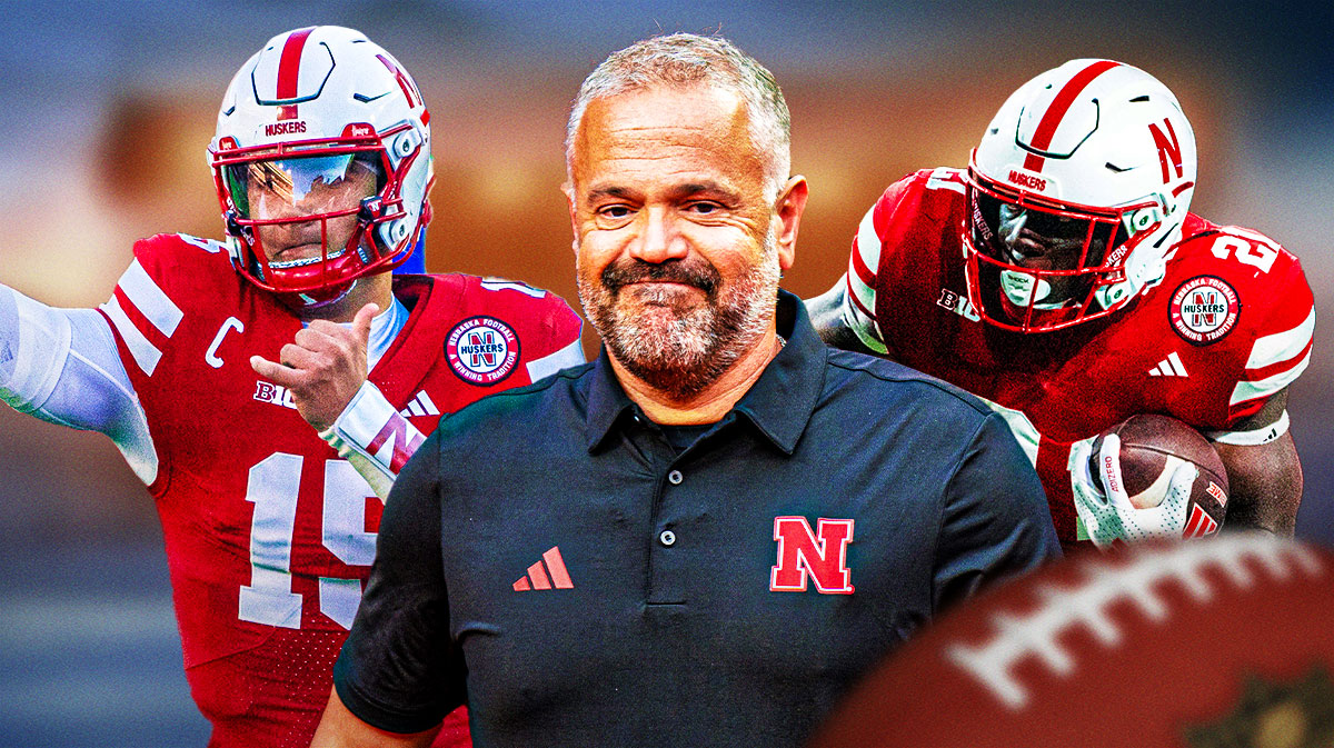 Matt Rhule in the middle, with Dylan Raiola and Emmett Johnson on the sides.