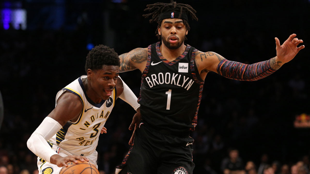 Indiana Pacers point guard Aaron Holiday (3) plays the ball against Brooklyn Nets point guard D'Angelo Russell (1) during the second quarter at Barclays Center.