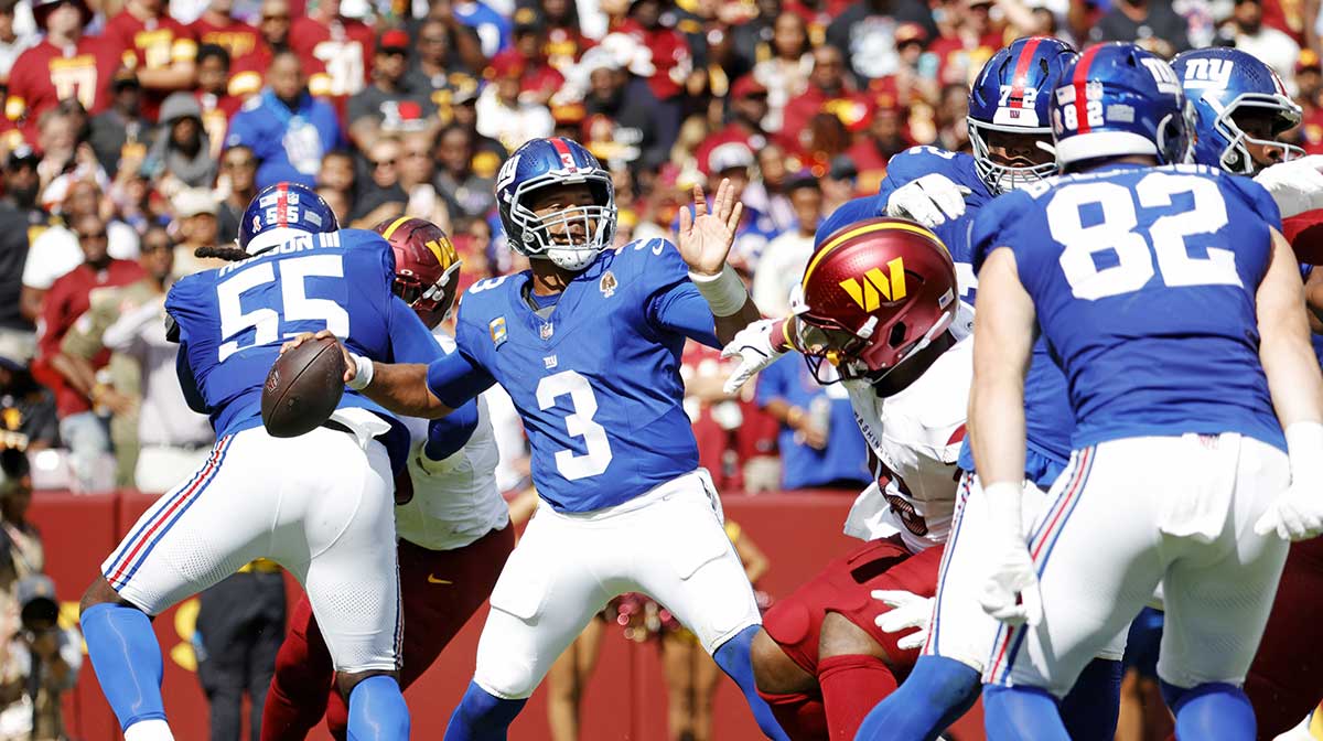 New York Giants quarterback Russell Wilson (3) makes a pass during the third quarter against the Washington Commanders at Northwest Stadium.