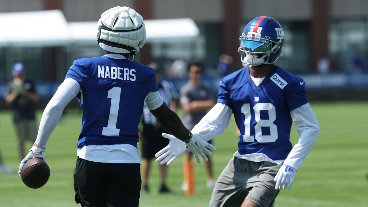 New York Giants wide receiver Malik Nabers (1) and New York Giants wide receiver Darius Slayton (18) celebrate during training camp at Quest Diagnostics Training Center.