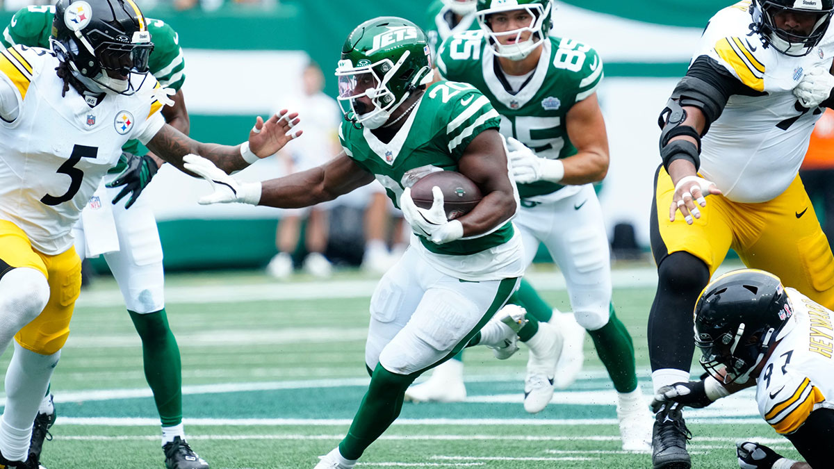 New York Jets running back Breece Hall (20) runs with the ball