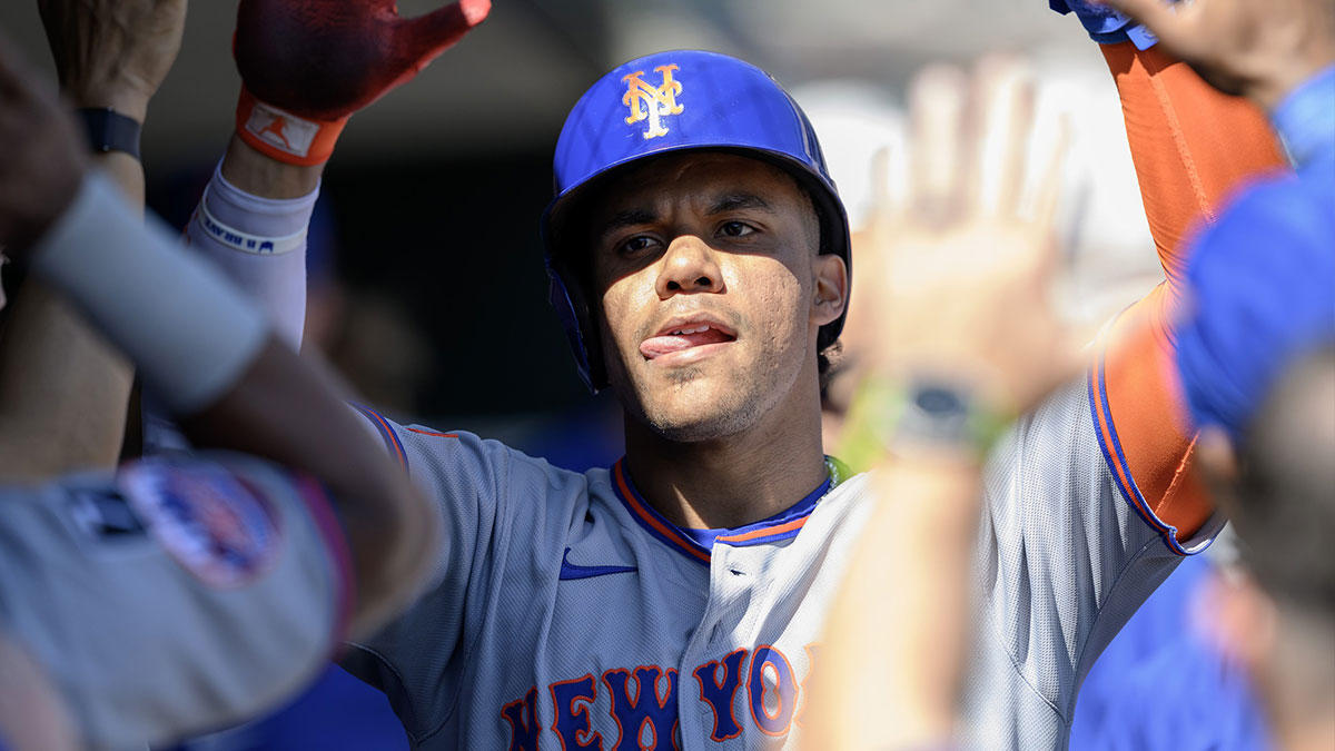 New York Mets right fielder Juan Soto (22) celebrates in the dugout after scoring a run against the Detroit Tigers in the sixth inning at Comerica Park.