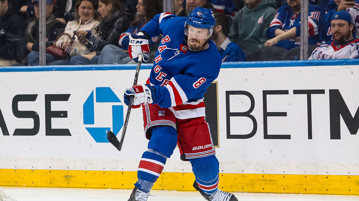 New York Rangers center J.T. Miller (8) clears the puck against the Vancouver Canucks during the second period at Madison Square Garden