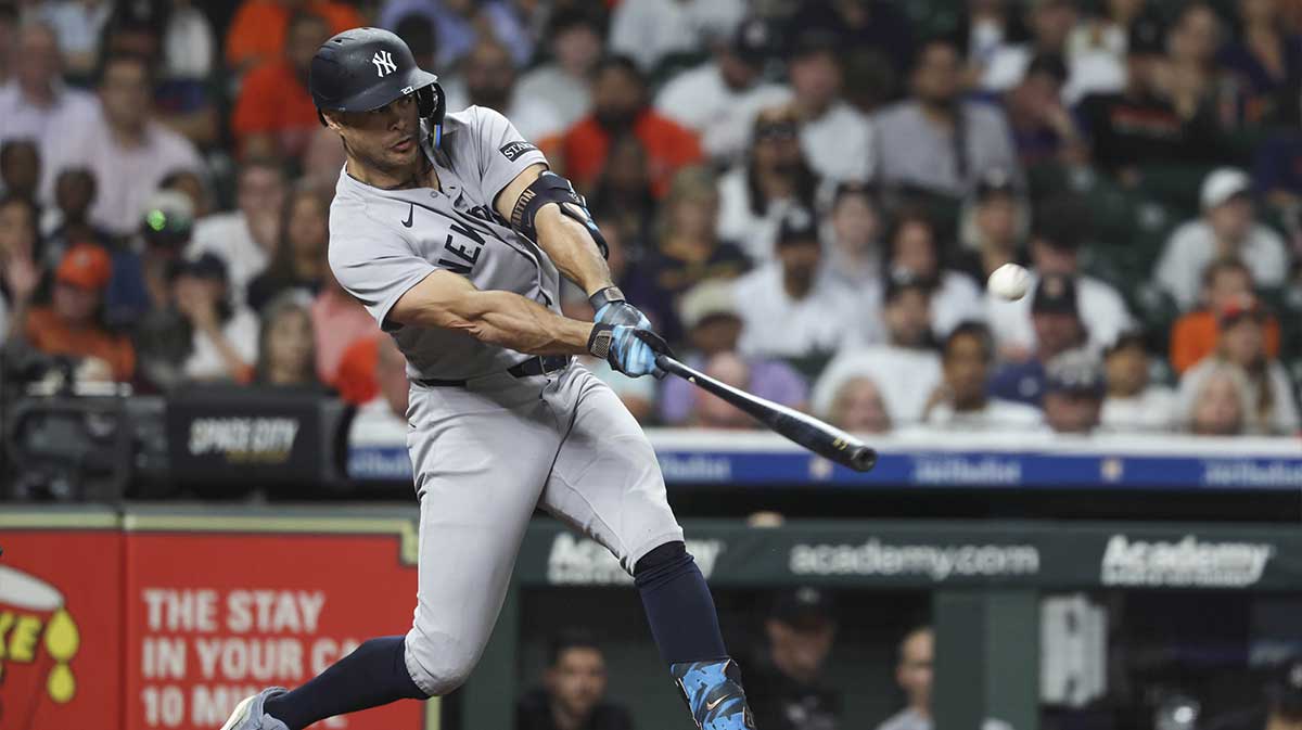 New York Yankees left fielder Giancarlo Stanton (27) bats during the seventh inning against the Houston Astros at Daikin Park.