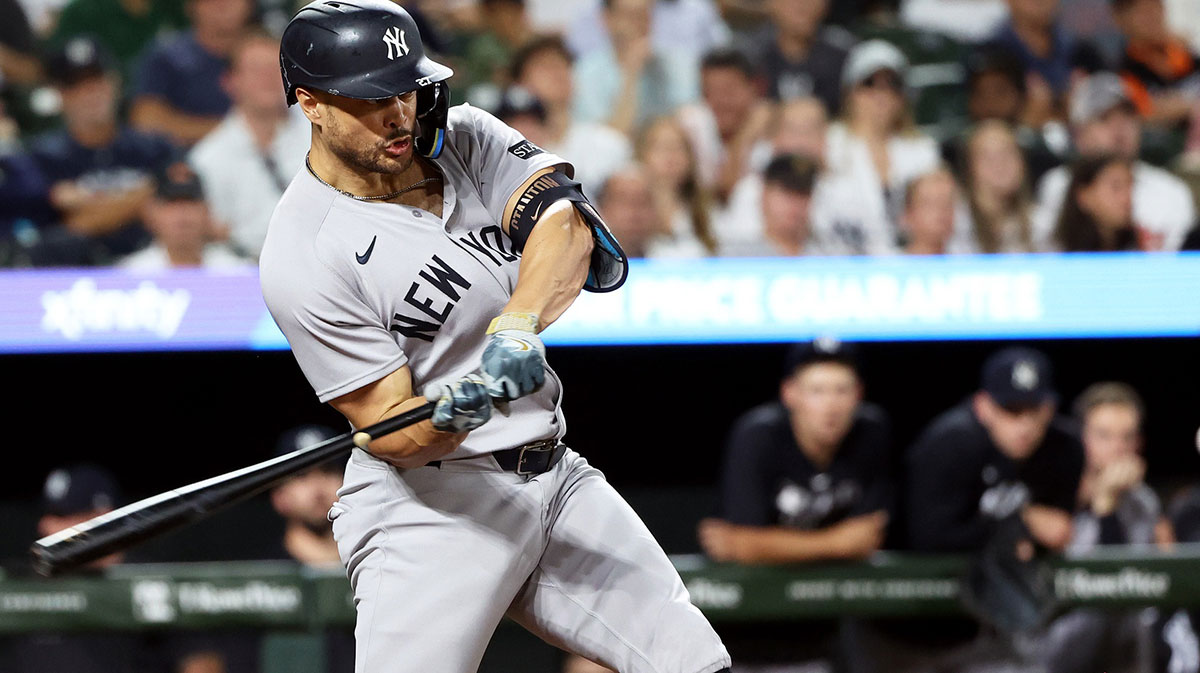 New York Yankees designated hitter Giancarlo Stanton (27) hits an RBI double during the seventh inning against the Baltimore Orioles at Oriole Park at Camden Yards.