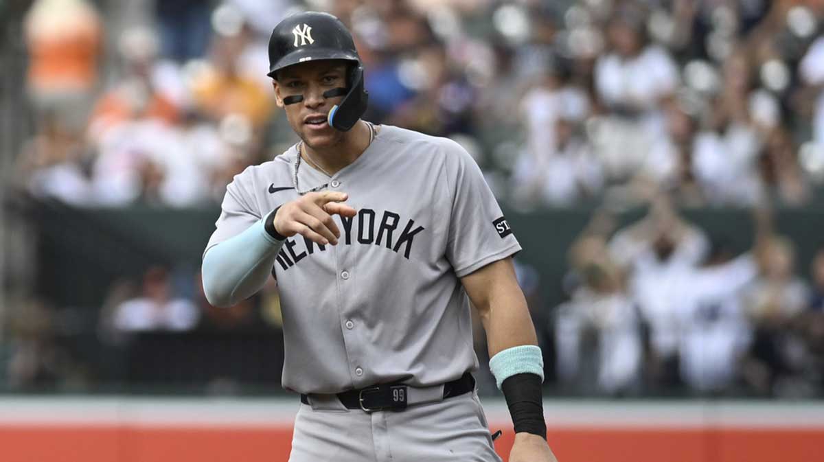 New York Yankees designated hitter Aaron Judge (99) reacts after New York Yankees first base Ben Rice (not pictured) sixth inning rbi single from second base against the Baltimore Orioles at Oriole Park at Camden Yards.