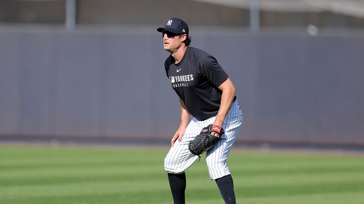 New York Yankees injured starting pitcher Gerrit Cole shags fly balls in the outfield during batting practice before a game against the Minnesota Twins at Yankee Stadium.