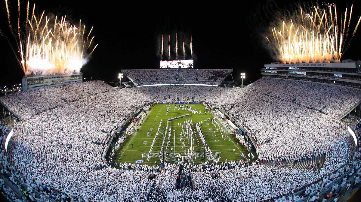 Fireworks burst overhead as the Penn State Nittany Lions take the field prior to a White Out game against the Washington Huskies at Beaver Stadium.