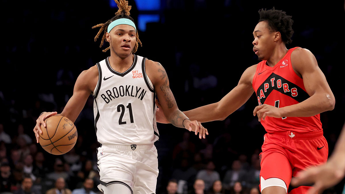 Brooklyn Nets forward Noah Clowney (21) brings the ball up court against Toronto Raptors forward Scottie Barnes (4) during the first quarter at Barclays Center.