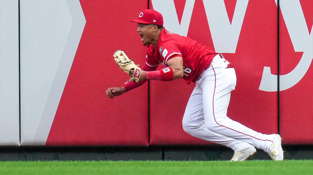 Cincinnati Reds third baseman Noelvi Marte (16) celebrates after leaping to rob a home run over the wall from Pittsburgh Pirates right fielder Bryan Reynolds (10) in the ninth inning of the MLB National League game between the Cincinnati Reds and the Pittsburgh Pirates.