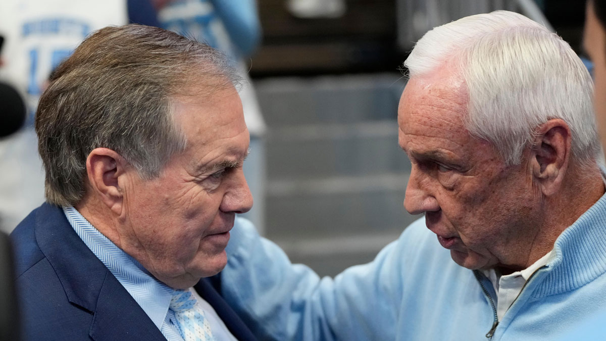 North Carolina Tar Heels head football coach Bill Belichick with former Tar Heels basketball coach Roy Williams before the game at Dean E. Smith Center.