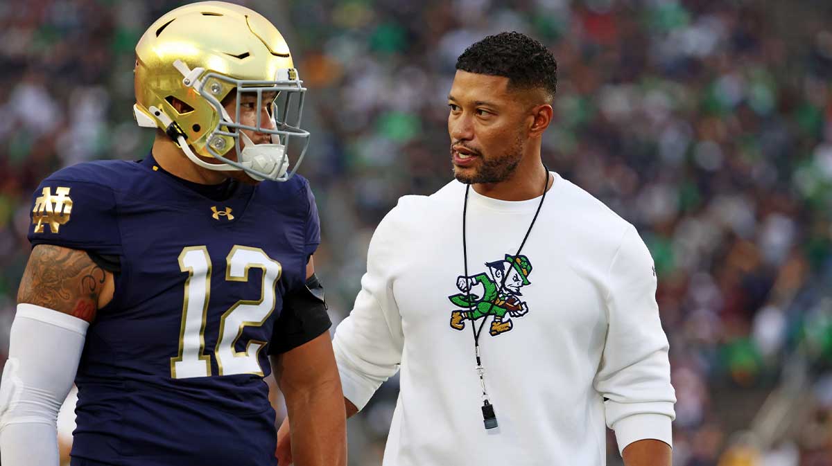 Notre Dame Fighting Irish head coach Marcus Freeman reacts with Notre Dame Fighting Irish quarterback Blake Hebert (12) during the first half against the Texas A&M Aggies at Notre Dame Stadium.