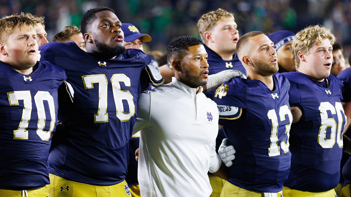 Notre Dame head coach Marcus Freeman celebrates with his players after winning a NCAA football game 56-30 against Purdue.