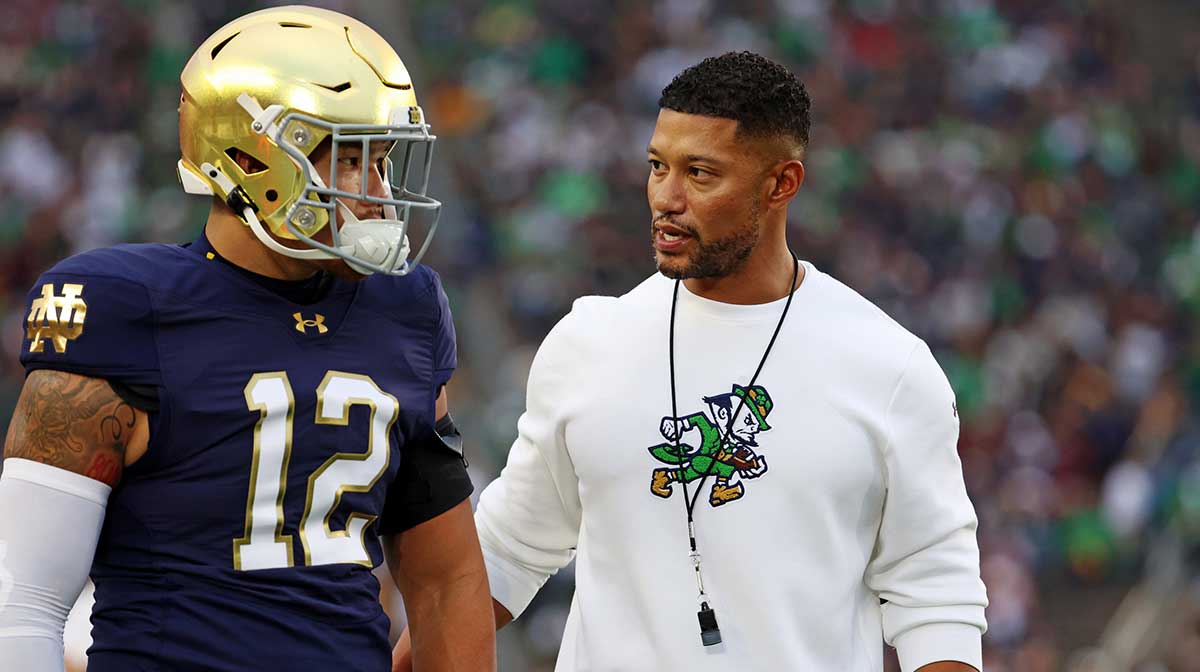 Notre Dame Fighting Irish head coach Marcus Freeman reacts with Notre Dame Fighting Irish quarterback Blake Hebert (12) during the first half against the Texas A&M Aggies at Notre Dame Stadium.