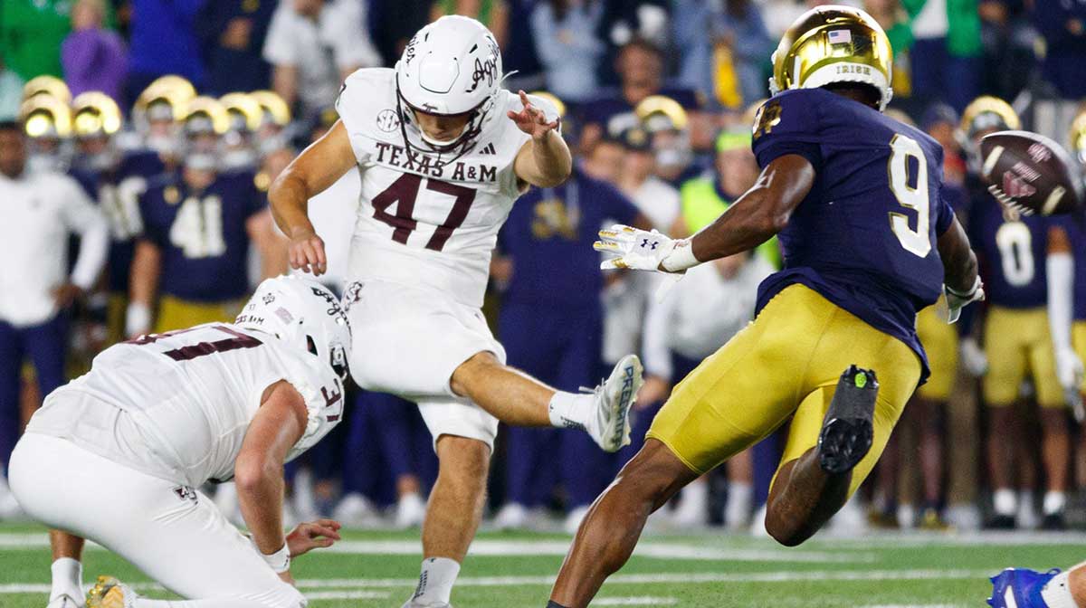 Texas A&M place kicker Randy Bond (47) kicks and scores an extra point to win a NCAA football game 41-40 against Notre Dame.