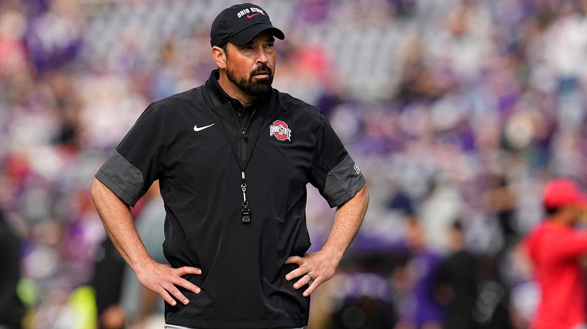 Ohio State Buckeyes head coach Ryan Day watches warm ups prior to the NCAA football game against the Washington Huskies at Husky Stadium