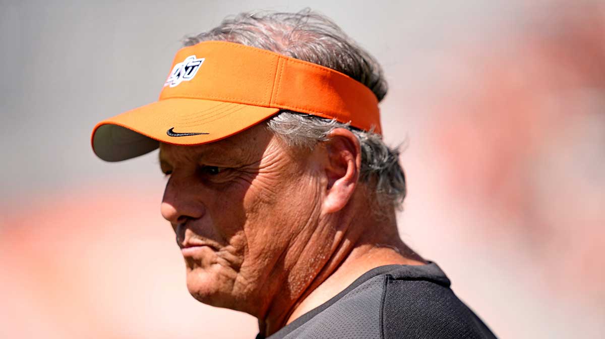 Oklahoma State Defensive Coordinator/Outside Linebackers Todd Grantham watches players warm up before the college football game between the Oklahoma State Cowboys and the Baylor Bears at Boone Pickens Stadium