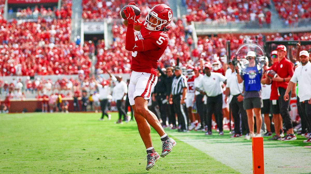 Oklahoma Sooners wide receiver Isaiah Sategna III (5) is left uncovered and catches a touchdown pass during the first half against the Auburn Tigers at Gaylord Family-Oklahoma Memorial Stadium.