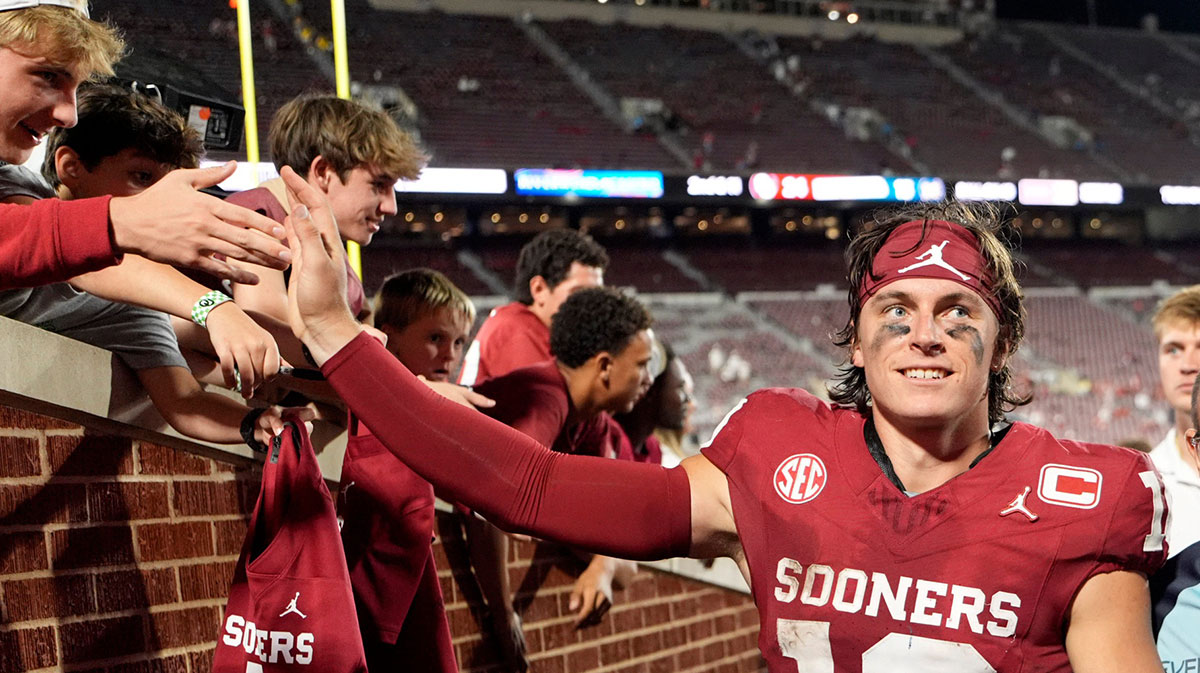 Oklahoma's John Mateer (10) greets following the college football game between the University of Oklahoma Sooner and the University of Michigan Wolverines.