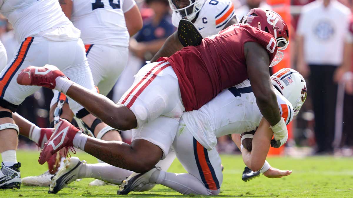 Oklahoma Sooners defensive lineman David Stone (0) brings down Auburn Tigers quarterback Jackson Arnold (11) during a college football game between the University of Oklahoma Sooners (OU) and the Auburn Tigers at Gaylord Family Ð Oklahoma Memorial Stadium in Norman, Okla., Saturday, Sept. 20, 2025.