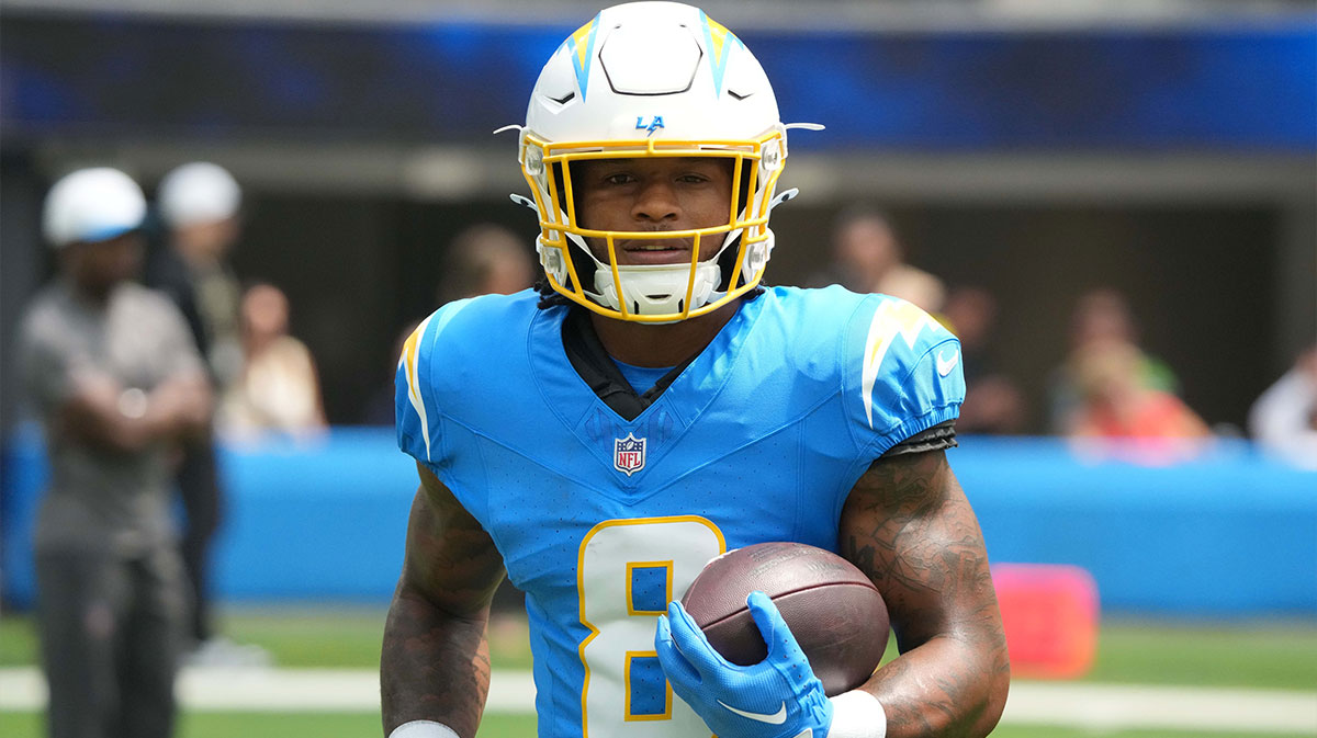 Los Angeles Chargers running back Omarion Hampton (8) carries the ball before the game against the New Orleans Saints at SoFi Stadium.
