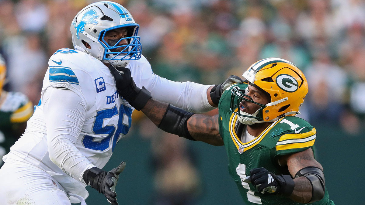 Green Bay Packers defensive end Micah Parsons (1) fights through a block by Detroit Lions offensive tackle Penei Sewell
