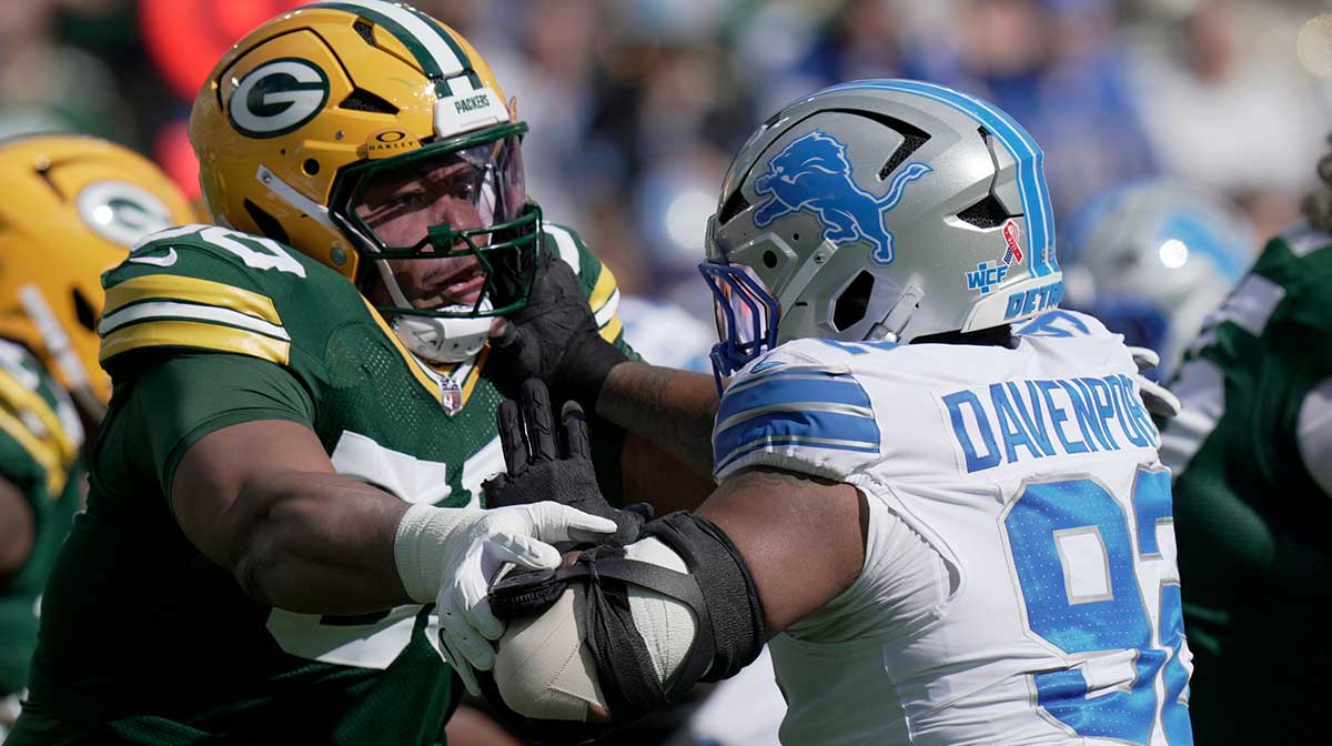 Green Bay Packers offensive tackle Zach Tom (50) blocks Detroit Lions defensive tackle Marcus Davenport (92) during the first quarter of their game Sunday, September 7, 2025 at Lambeau Field in Green Bay, Wisconsin.