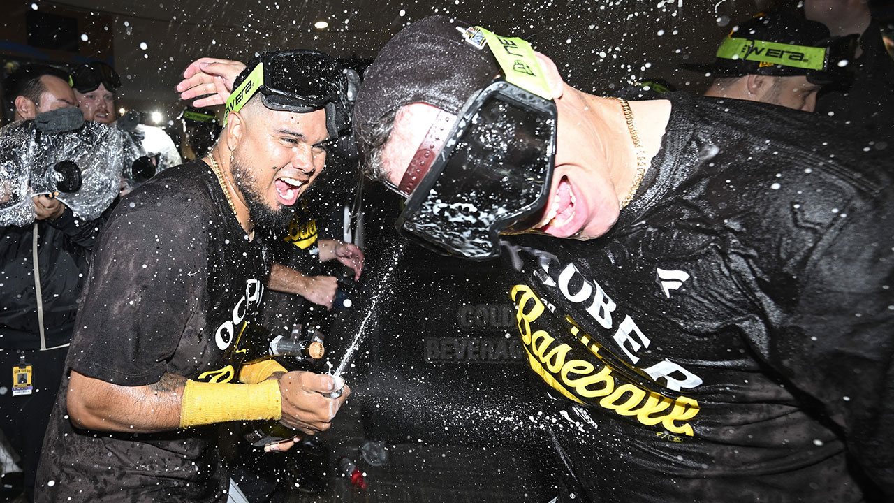 Padres first baseman Luis Arraez (4), left, and Freddy Fermin (54) celebrate