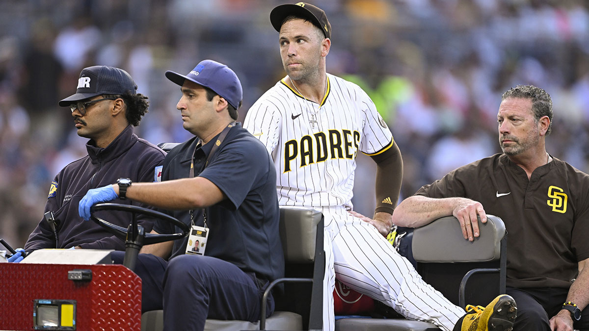 San Diego Padres relief pitcher Jason Adam (40) is taken away in a cart after being injured during the seventh inning against the Baltimore Orioles at Petco Park.