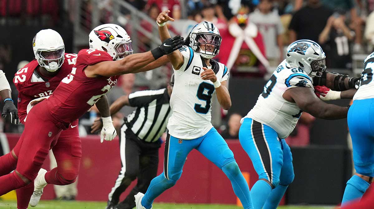 Arizona Cardinals linebacker Zaven Collins (25) hits Carolina Panthers quarterback Bryce Young (9) as he throws the ball at State Farm Stadium on Sept 14, 2025.