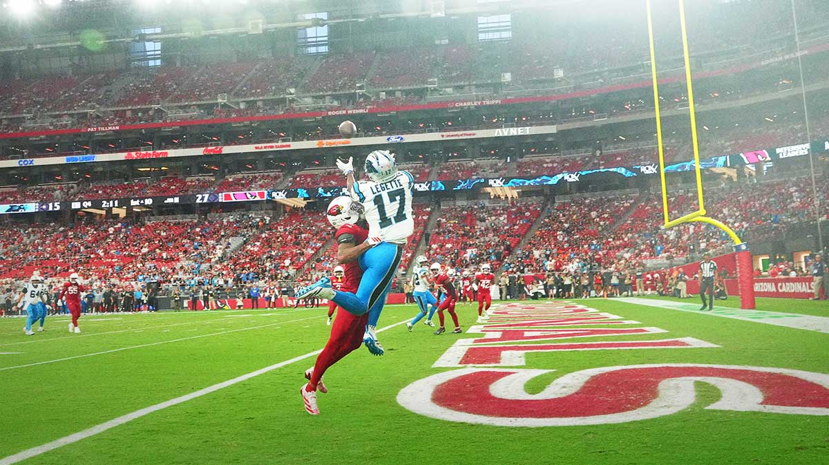 Carolina Panthers wide receiver Xavier Legette (17) reaches for the ball during the fourth quarter against the Arizona Cardinals against the Arizona Cardinals at State Farm Stadium.
