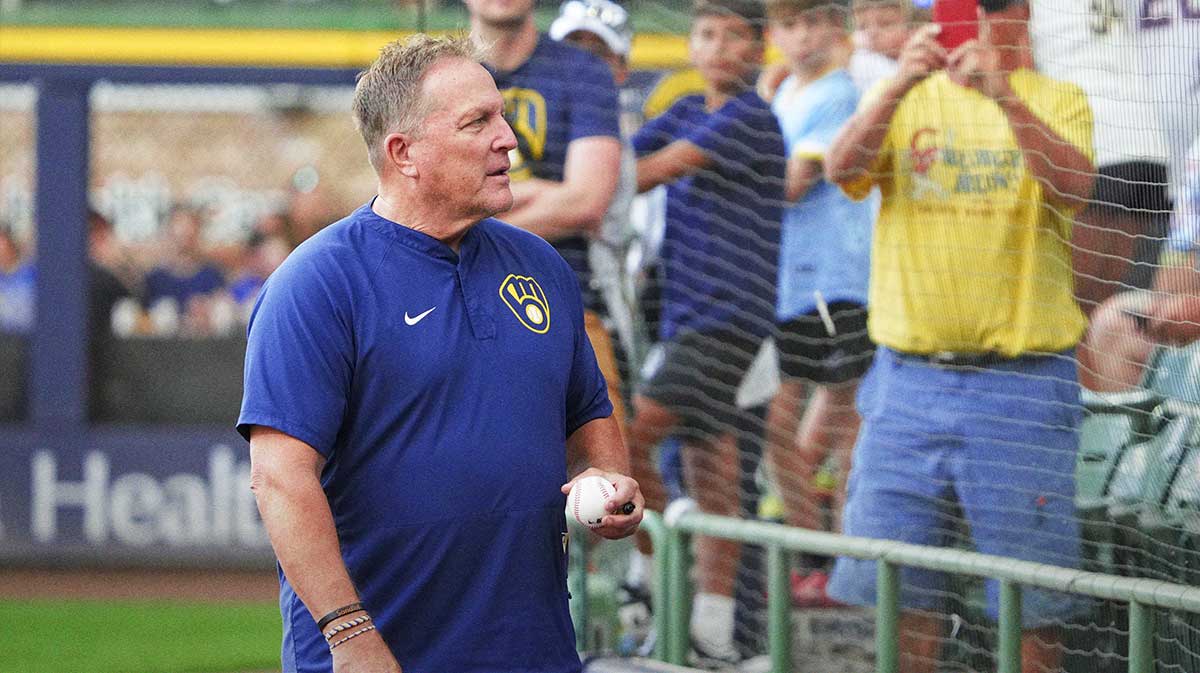 Milwaukee Brewers manager Pat Murphy (49) looks for a fan to give a ball to before a game against the Pittsburgh Pirates at American Family Field.
