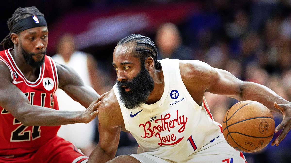 76ers guard James Harden (1) dribbles the ball against Chicago Bulls guard Patrick Beverley (21) during the fourth quarter at Wells Fargo Center with Michael Jordan in the background
