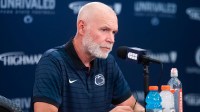 Penn State first-year defensive coordinator Jim Knowles talks with reporters during football media day