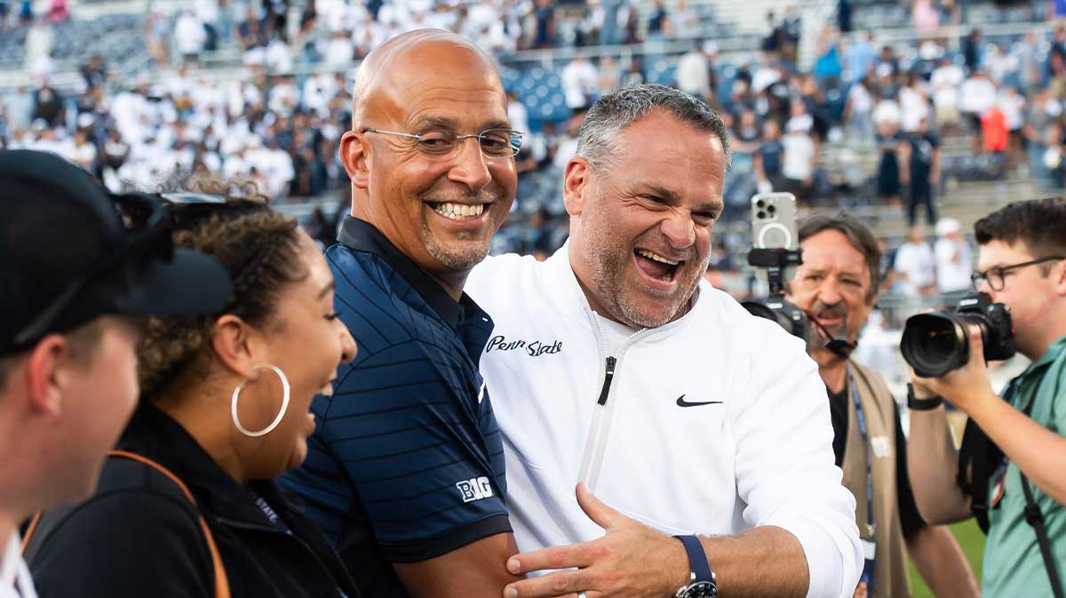 Penn State Athletic Director Pat Kraft, right, laughs with head coach James Franklin following a 46-11 win over Nevada.