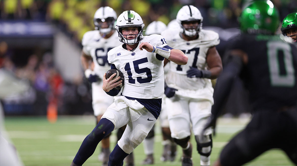 Penn State Nittany Lions quarterback Drew Allar (15) runs for a gain against the Oregon Ducks during the fourth quarter in the 2024 Big Ten Championship game at Lucas Oil Stadium.