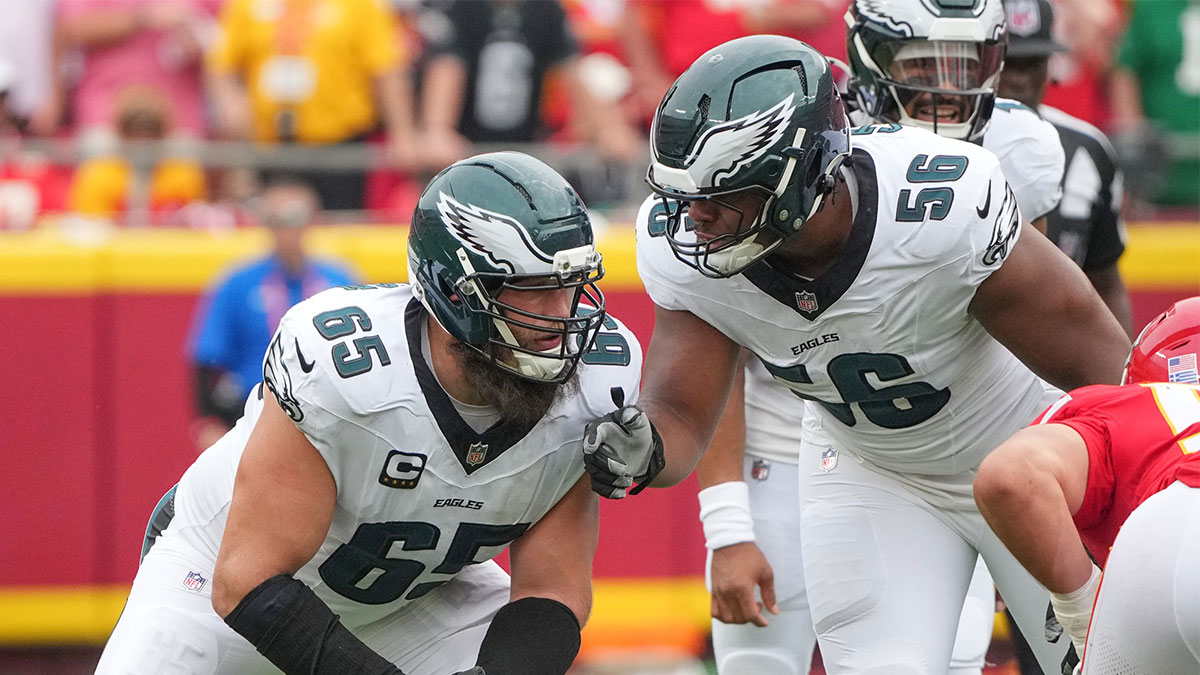 Philadelphia Eagles offensive tackle Lane Johnson (65) talks with guard Tyler Steen (56) on the line of scrimmage against the Kansas City Chiefs during the game at GEHA Field at Arrowhead Stadium.