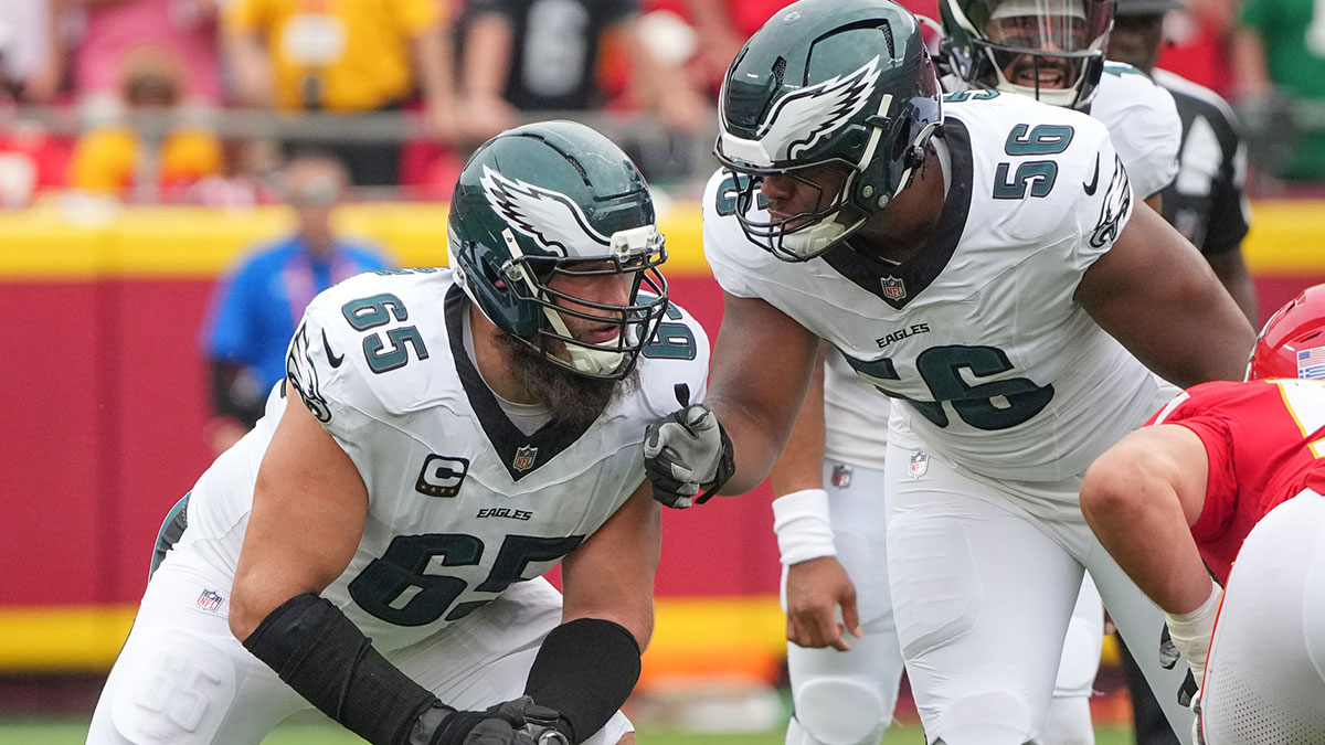 Philadelphia Eagles offensive tackle Lane Johnson (65) talks with guard Tyler Steen (56) on the line of scrimmage against the Kansas City Chiefs during the game at GEHA Field at Arrowhead Stadium.
