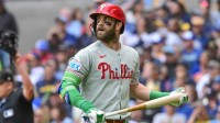 Philadelphia Phillies first baseman Bryce Harper (3) reacts after flying out against the Milwaukee Brewers in the first inning at American Family Field.