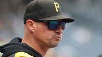 Pittsburgh Pirates manager Don Kelly (12) looks on from the dugout against the Milwaukee Brewers during the first inning at PNC Park.