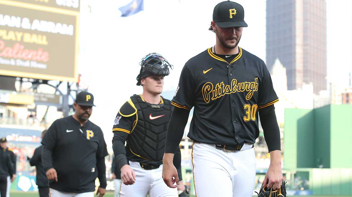 Pirates starting pitcher Paul Skenes (30) walks in